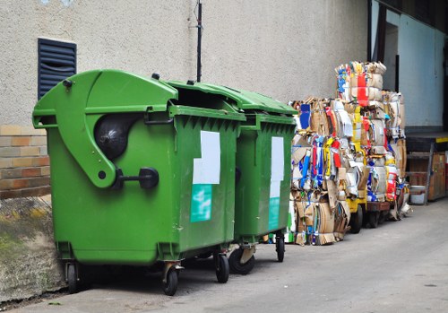 Workers sorting different types of builders waste